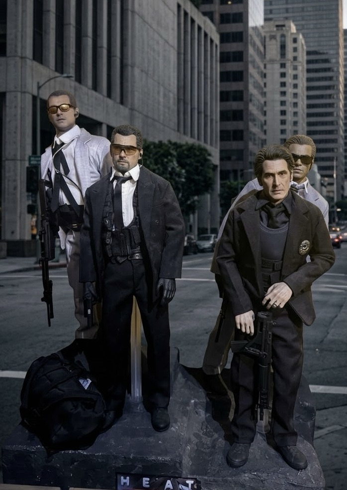 The Heat crew figures standing on a Los Angeles street backdrop